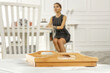 © magdal3na - Table background of free space and slim young woman in home interior.