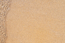 Marine Background. An Oncoming Wave On The Sand.