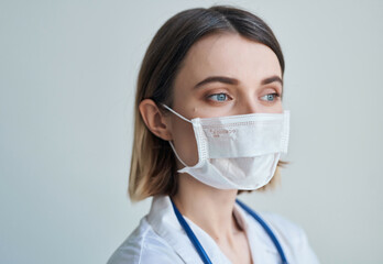 Wall Mural - nurse in white coat medical mask hospital