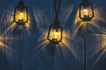 Wall Mural - Vintage background. Christmas light bulbs on old wood background