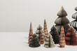 © netrun78 - Scandinavian christmas paper and wooden xmas trees. Modern christmas decoration, minimalist and plastic free