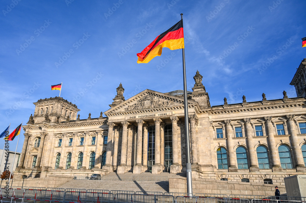 German flag flying in front of government buildings in Berlin.