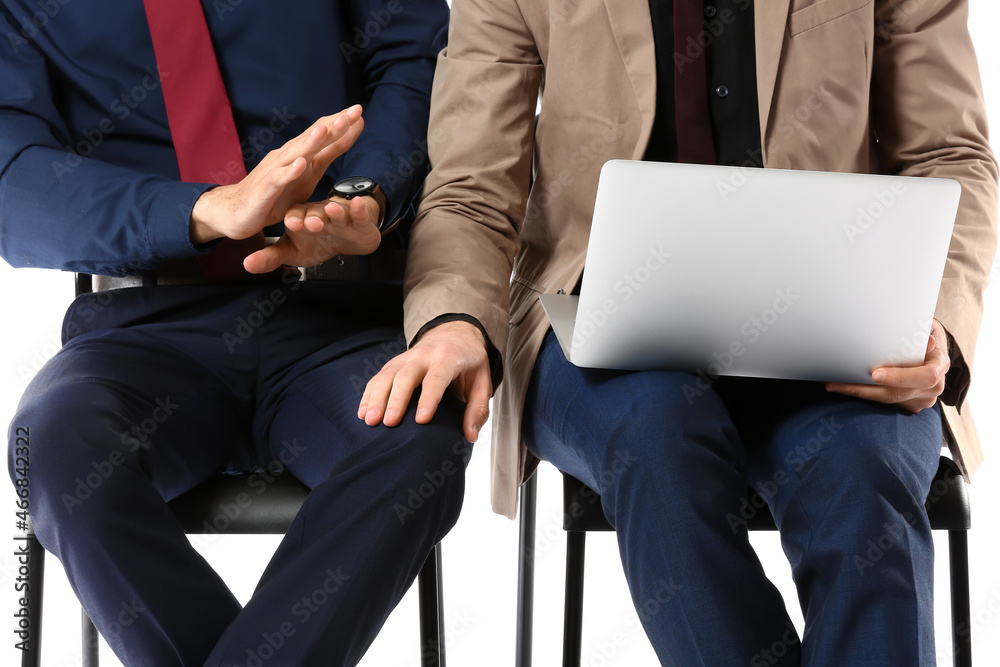 Man harassing his male colleague on white background