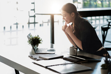 businesswoman celebrating business success achievement. Happy employee feeling motivated by good work, receive great news in email, positive exam results