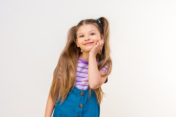 Wall Mural - Beautiful little girl on a white isolated background.