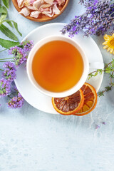 Poster - Tea with dry fruit and flowers, shot from the top with a place for text. Lavender, orange, thyme, and other ingredients