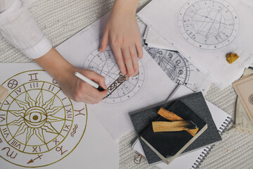 Astrology. Astrologer calculates natal chart and makes a forecast of fate.Tarot cards, Fortune telling on tarot cards magic crystal, occultism, Esoteric background. Fortune telling,tarot predictions.