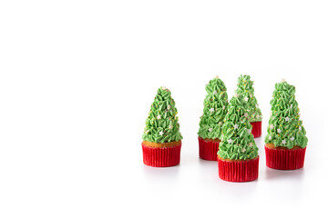 Christmas tree cupcakes isolated on white background. Copy space