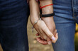 couple in love holds each other's hands, hands in different decorations