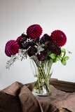Fototapeta  - Dahlias bouquet on a wooden table