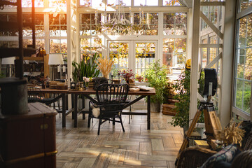 Wall Mural - room in a country house with large panoramic windows at sunset. 