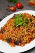 © Дмитрий Ульянов - pilaf with beef on a white plate in a restaurant