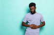 © F8  \ Suport Ukraine - Young african man with hand on stomach because indigestion, painful illness feeling unwell. Ache concept.