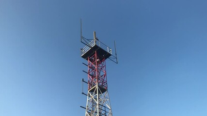 Poster - red radio beacon against blue sky