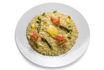 Wall Mural - Risotto with asparagus in white dish isolated on white background, Italian rice gourmet recipe