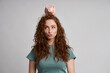 © gpointstudio - Funny woman with piggy bank on the head