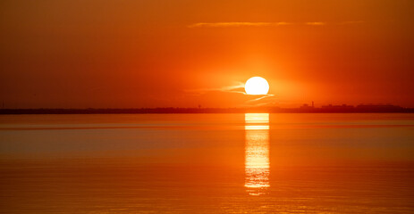 Beautiful view of the golden sunset sky over the ocean