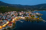 Fototapeta Uliczki - Aerial evening view of Neos Marmaras city, marina, port. Greece, Sithonia peninsula of Halkidiki	