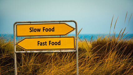 Street Sign Slow versus Fast Food