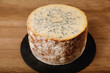 Stilton cheese on a rustic background