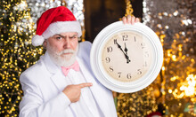 Time For Party. Clock Showing Almost Midnight. Time To Celebrate Winter Holidays. Hurry Up. Christmas Countdown Arriving. Wait For Xmas Presents. Santa Man Hold Alarm Clock. New Year Midnight
