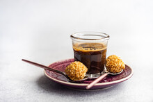 Homemade Candy Balls Coated In Chopped Nuts With A Cup Of Black Coffee