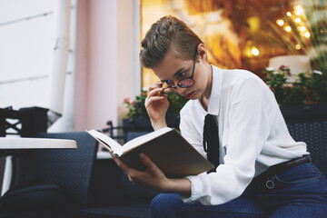 Wall Mural - short haired woman with a book in his hands reading Lifestyle