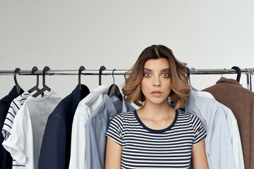 emotional woman Shopaholic choosing clothes shopping in store studio lifestyle