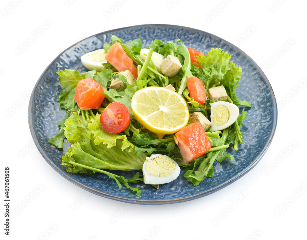 Delicious salad with salmon and fresh vegetables on white background