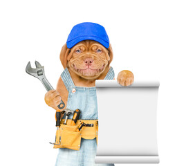 Poster - Funny puppy wearing blue cap and  overalls with tool belt holds adjustable wrench and shows empty list. Isolated on white background