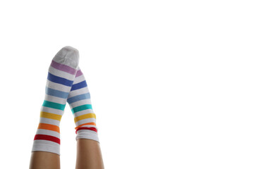 Wall Mural - Female legs in rainbow socks isolated on white background