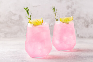 Wall Mural - Refreshing pink drink or cocktail with ice