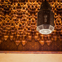 Sticker - Low angle shot of a nicely decorated ceiling with many ornaments and beautiful lamp hanging from it