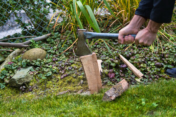 Canvas Print - Shot of a man breaking a stick in a garden