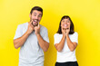 © luismolinero - Young couple isolated on yellow background smiling with a happy and pleasant expression