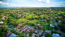 A Bird's-eye View Of The Surroundings Of Residential Buildings And Beautiful Green Fields. Houston, Texas, USA. Development Of Suburban Housing Construction. General Plan