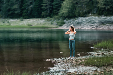 Canvas Print - Shallow focus of a caucasian female posing in the park  with blurred background