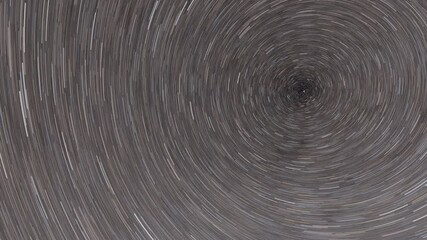 Wall Mural - Stars rotating around Polaris star creating startrails at night sky.