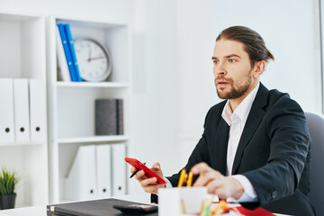 manager office work documents with a phone in hand Lifestyle