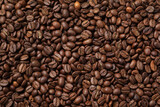 Fototapeta Kuchnia - Pile of roasted coffee beans as background, top view