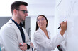 © Ladanifer - Two pharmacist researchers discussing about chemistry.