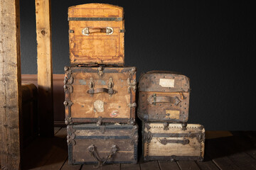 old vintage travel trunks stacked up