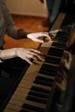 Cropped Image Of Person Playing The Piano