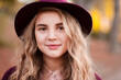 © Scopio - Portrait of blonde teenage girl wearing a hat outdoor