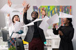 © ABCreative - Happy joyful satisfied employees of company's corporations of different nationalities skin colors laugh enjoy tossing documents cards reports up in the air they completed project won contract