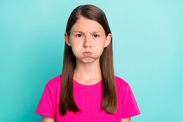 photo of unhappy upset angry small girl bad mood face dislike problem isolated on pastel teal color 