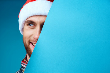 Wall Mural - handsome man in a christmas blue mockup Poster isolated background