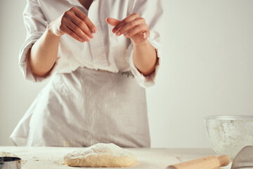 Wall Mural - baker rolling dough flour cooking