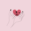 Serce na dłoni. Kobiece dłonie trzymające czerwone serce. Koncept miłości, przyjaźni, dobroci, dobroczynności, darowizny. Minimalistyczny design na walentynki, kartki okolicznościowe, wesele.