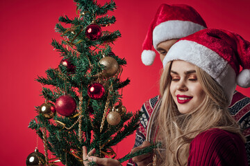 Wall Mural - emotional young couple celebrating christmas decoration together